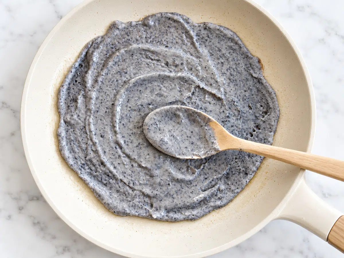 black bean tortilla being made in a skillet
