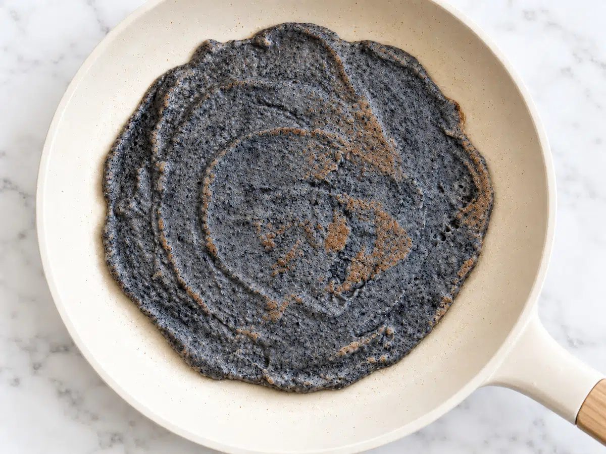 cooked black bean tortilla in a skillet