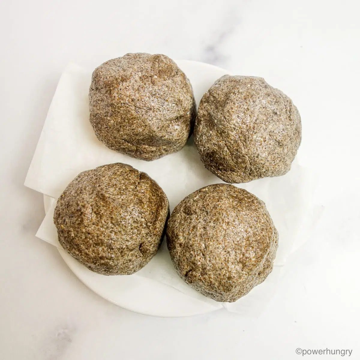 chia flatbread dough divided into four balls