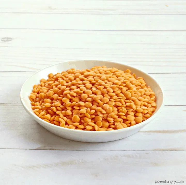 a small white dish of red lentils