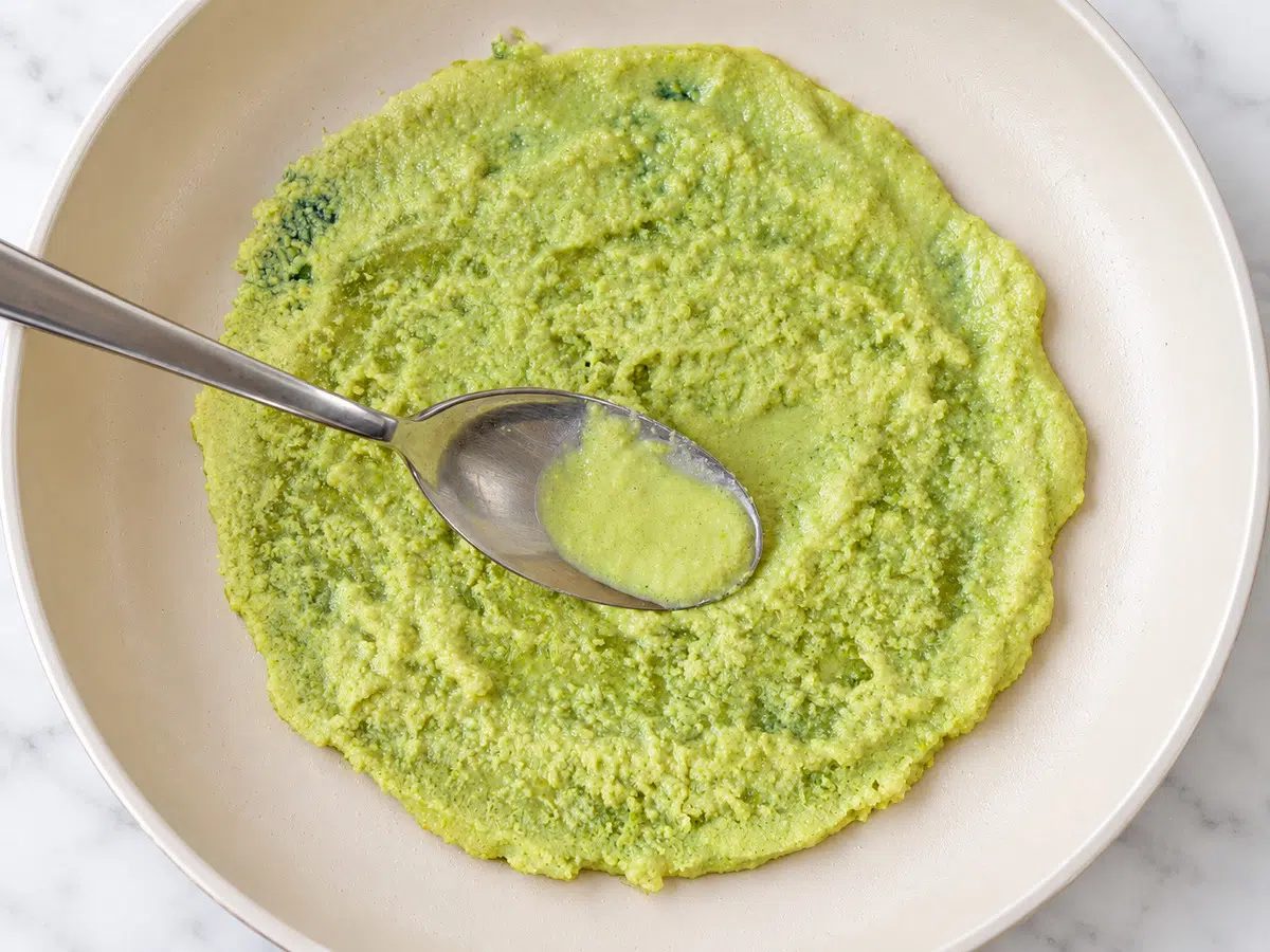 spreading batter in a skillet for 1-ingredient split pea flatbread
