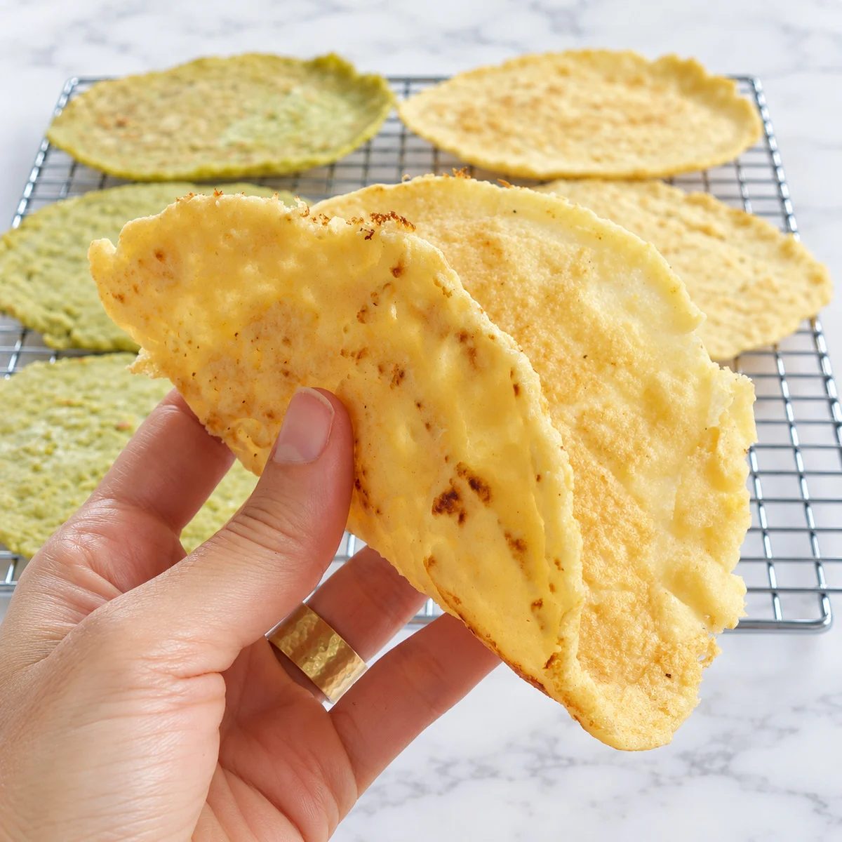 a hand holding a 1-ingredient split pea flatbread
