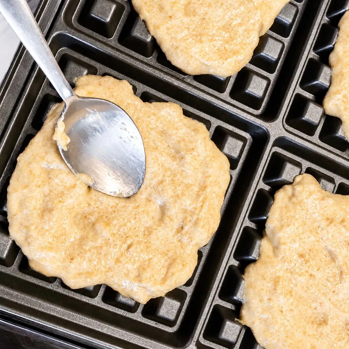 flaxseed waffles batter in waffle iron