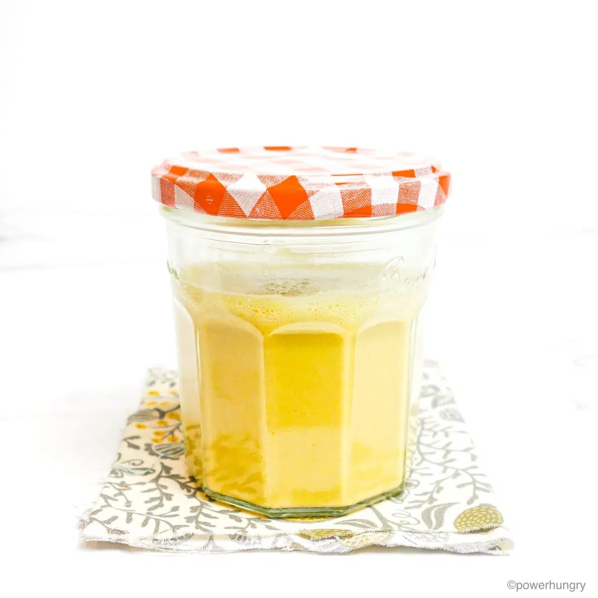 a glass jar filled with vegan egg scramble batter