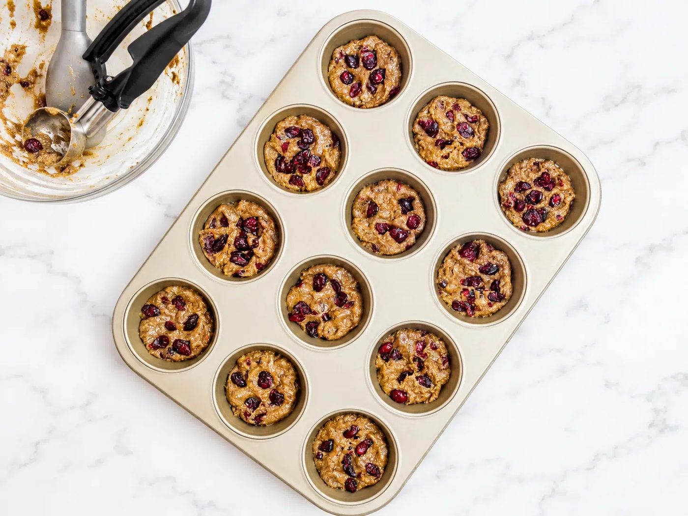 portions of chia seed cookie dough in muffin tin