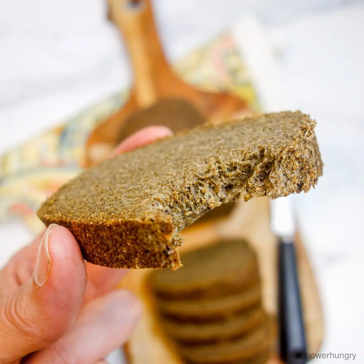 a slice of chia bread with a bite taken out