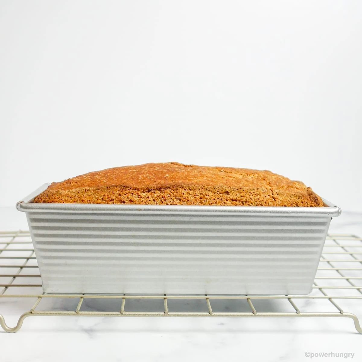 side view of millet banana bread cooling on a wire rack