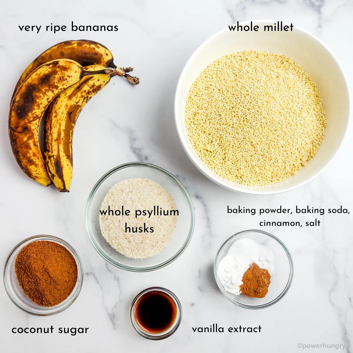overhead shot of the ingredients for millet banana bread on a marble surface