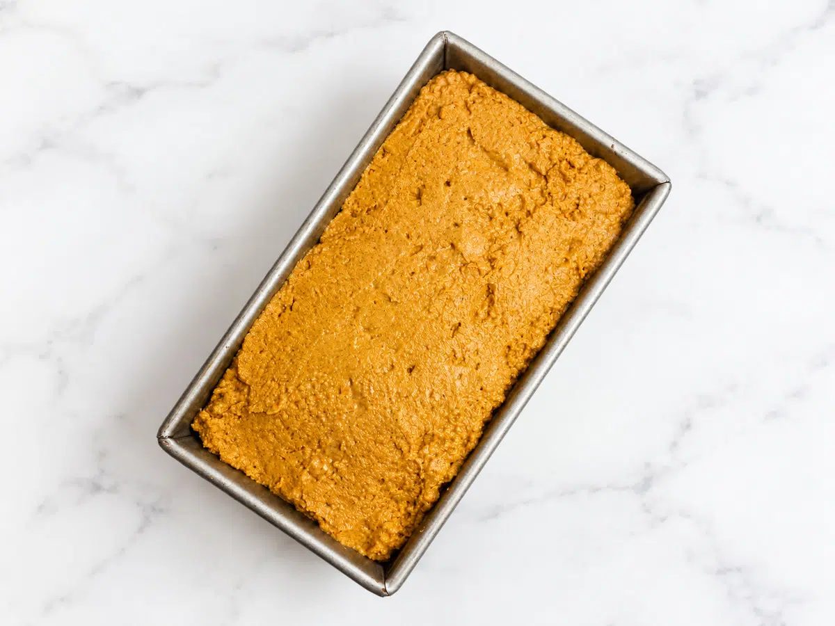 millet pumpkin bread dough in pan