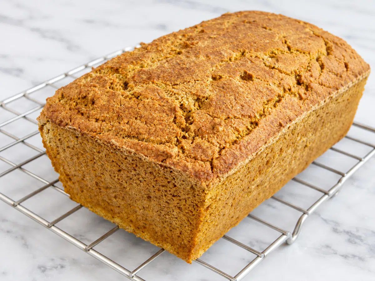 millet pumpkin bread out of pan on a cooling rack
