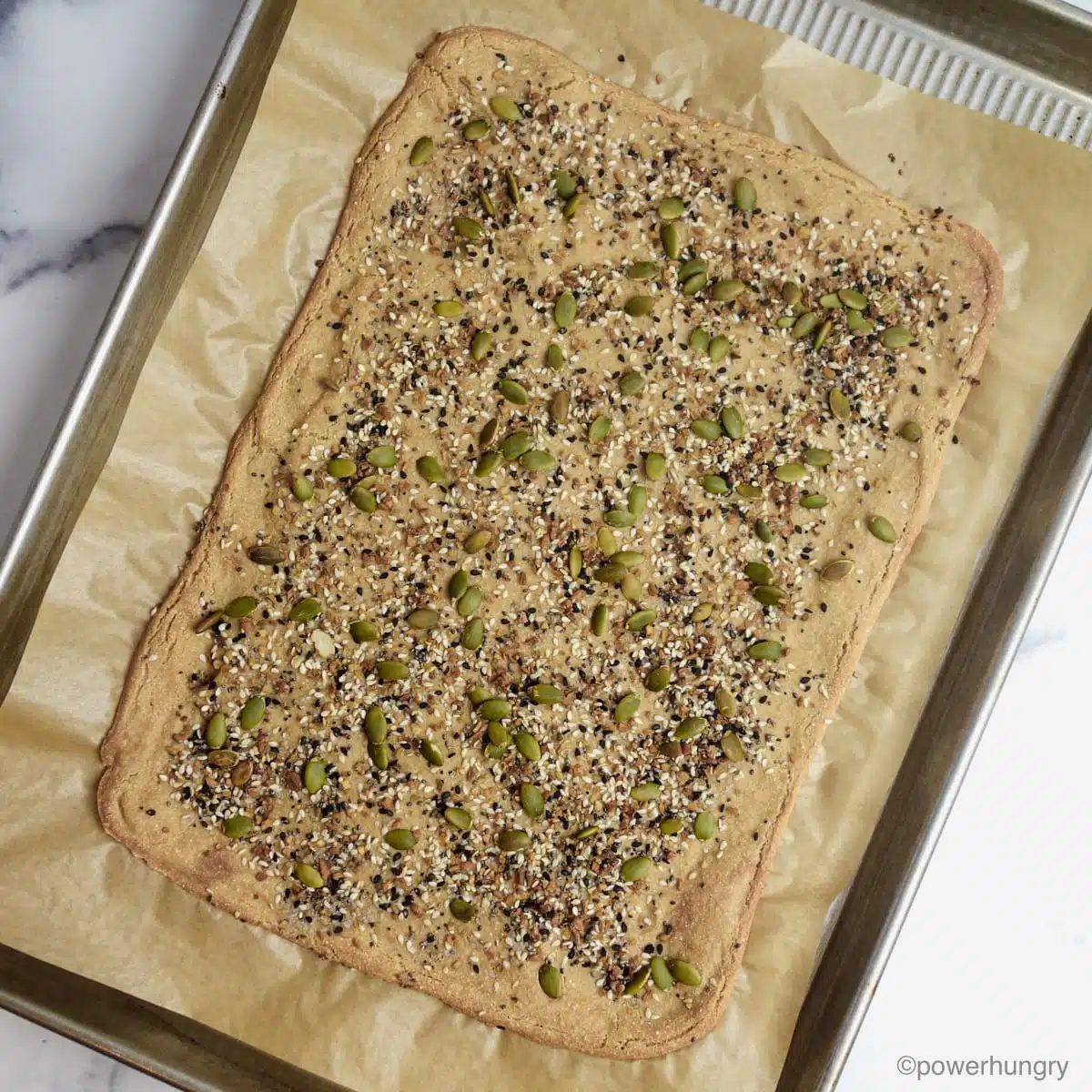baked amaranth flatbread on a cooling sheet