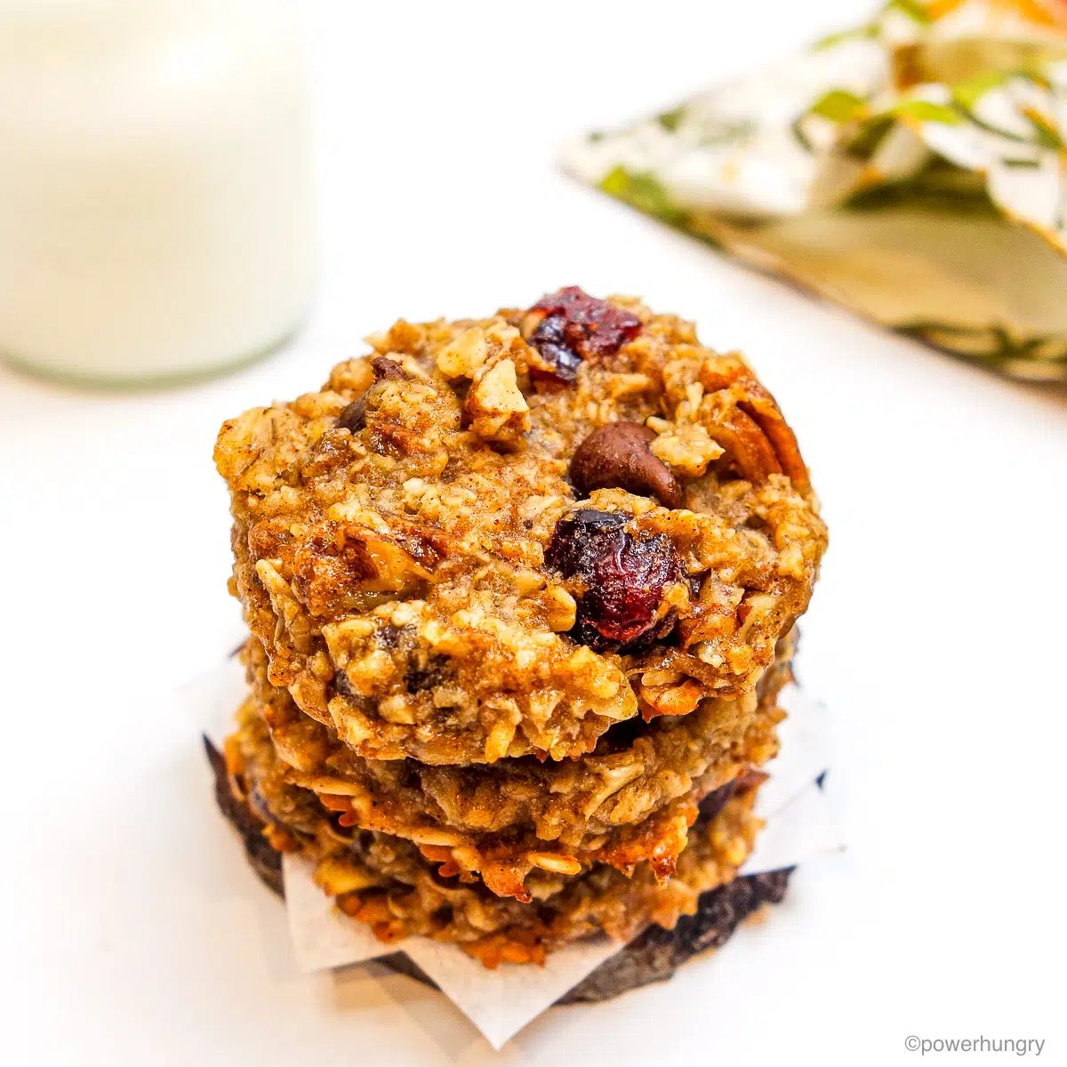 stack of three 2 ingredient oatmeal cookies with a glass of milk