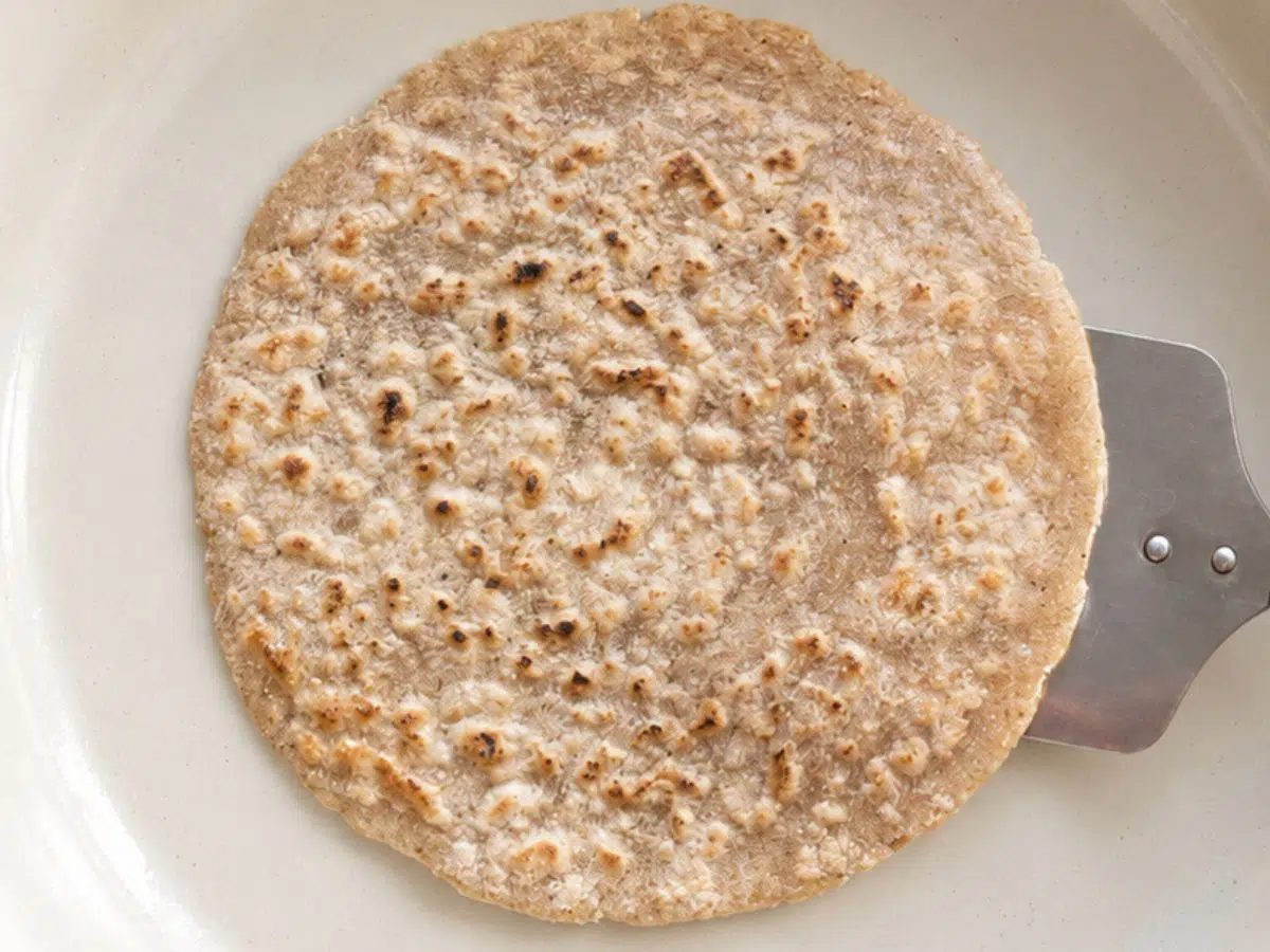 cassava flour tortilla in a skillet, browned