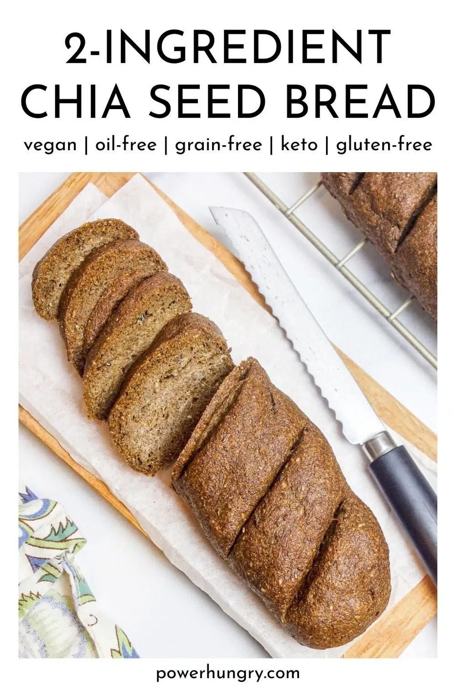 overhead shot of a loaf of vegan 2-ingredient chia seed bread on a cutting board with a knife