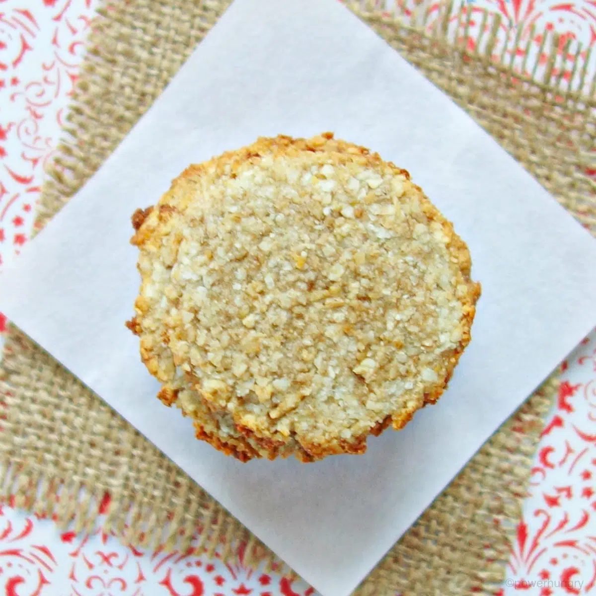 overhead shot of stack of coconut banana cookies on a red and white tabletop