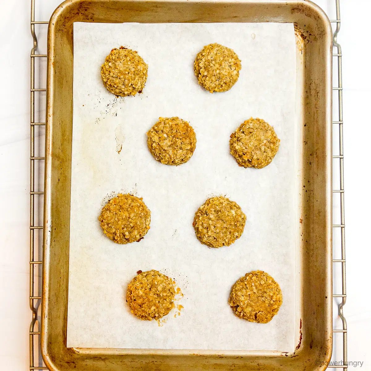 baking sheet with baked millet banana cookies