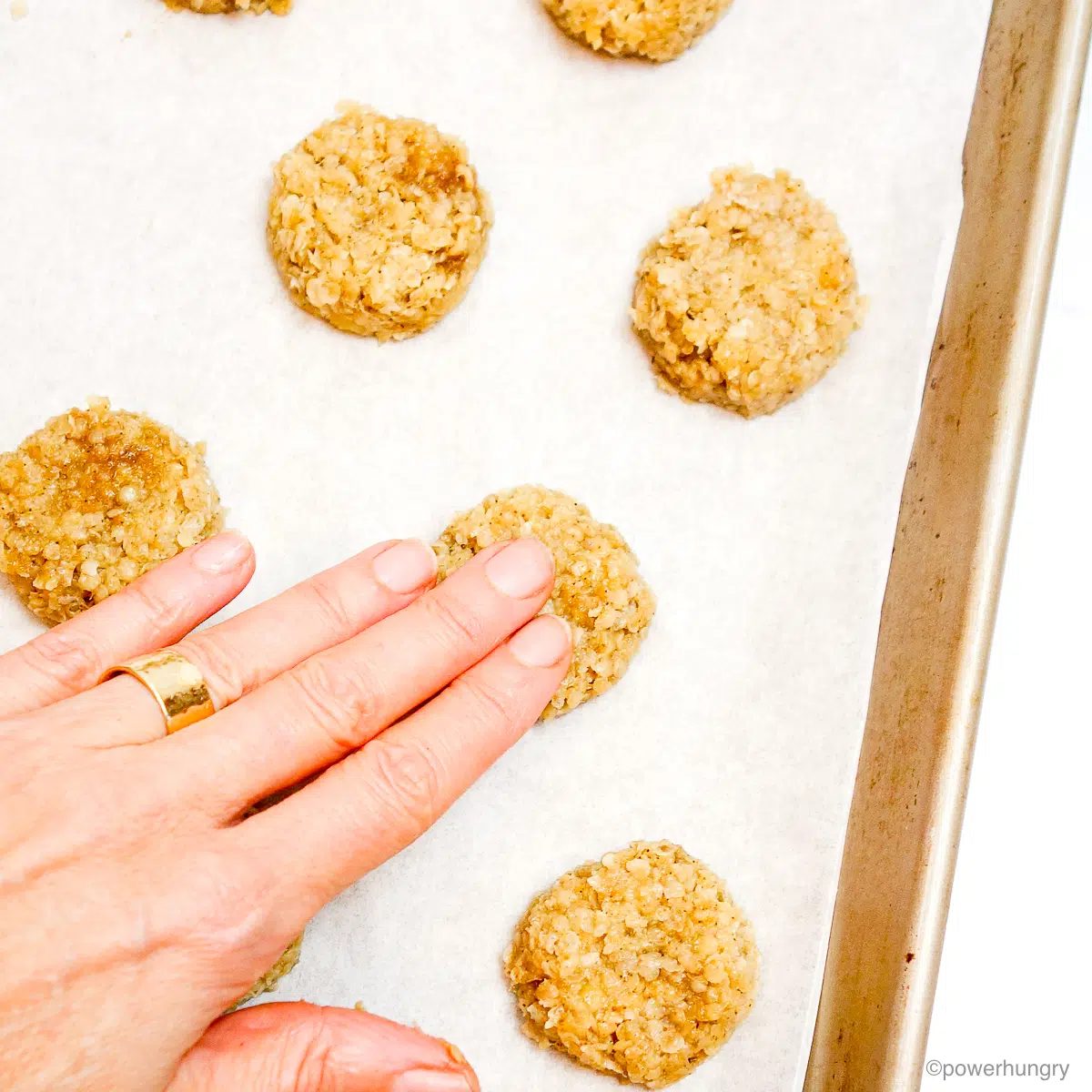 millet banana cookie dough portions getting flattened by fingertips