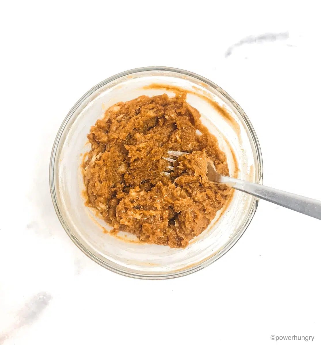 peanut butter banana cookie dough in a glass bowl