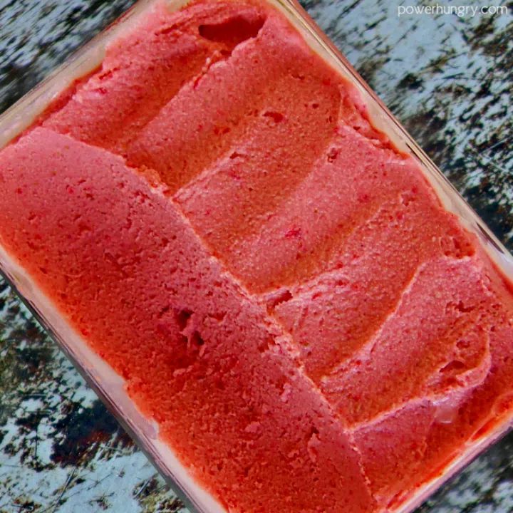 freezer container filled with strawberry sorbet