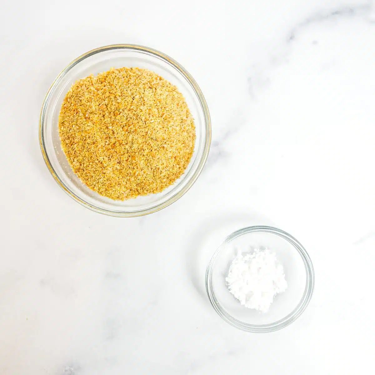 ingredients for microwave flax bread on a white marble background