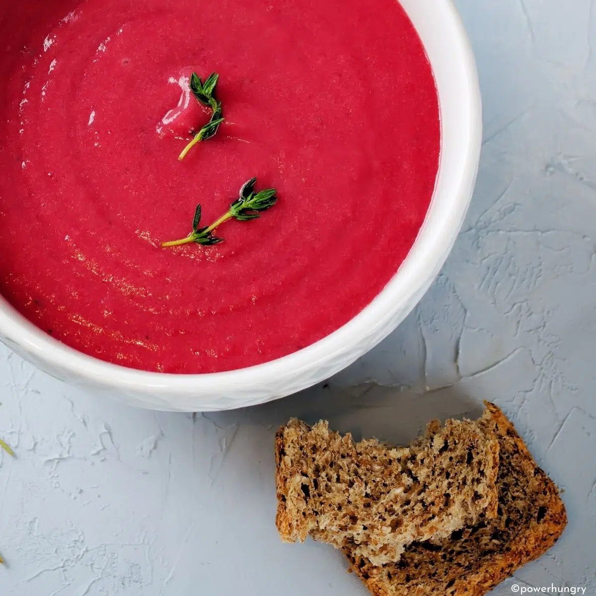 overhead shot of 20 minute creamy beet soup in a white bowl