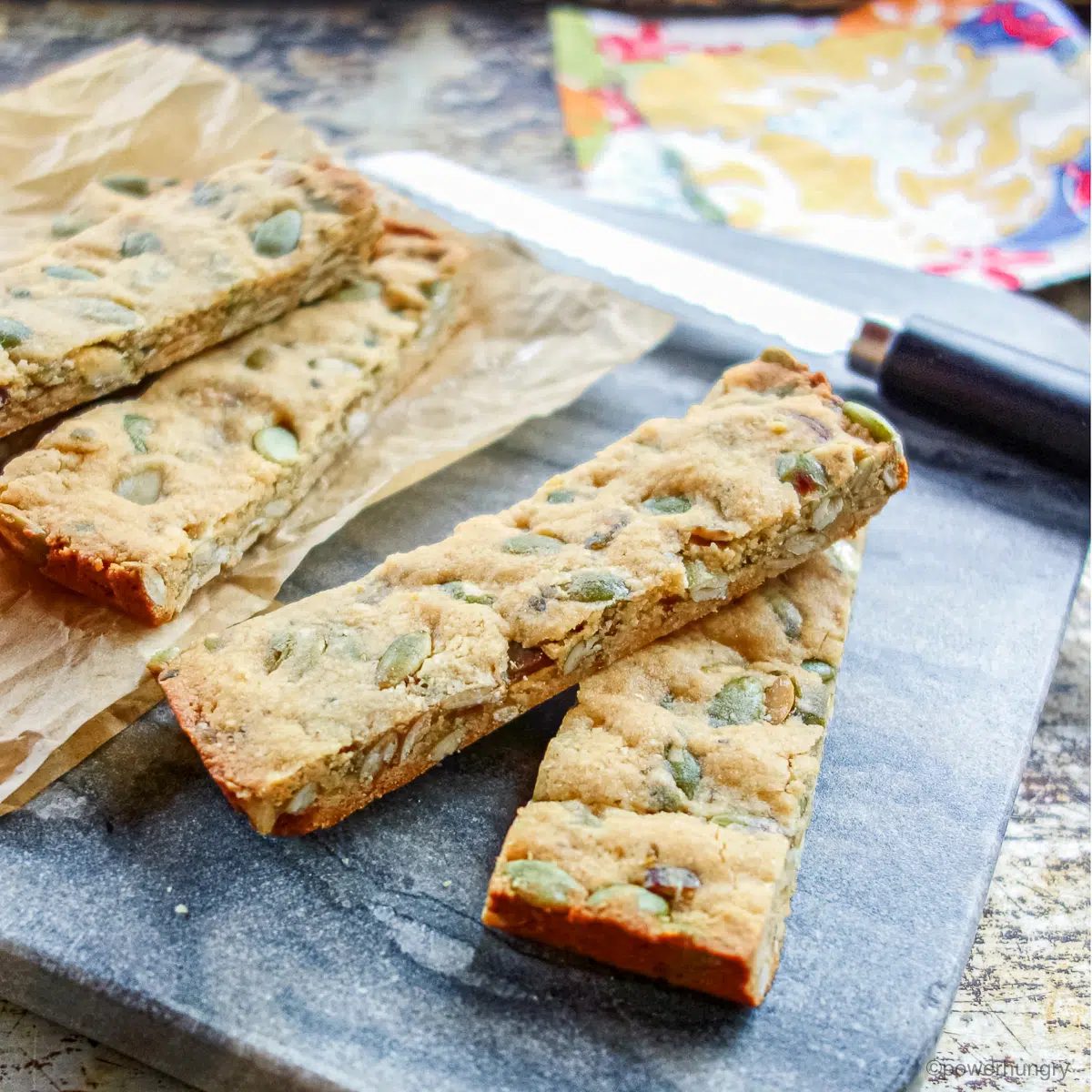 6 grain-free 3 ingredient almond flour granola bars on a cutting board