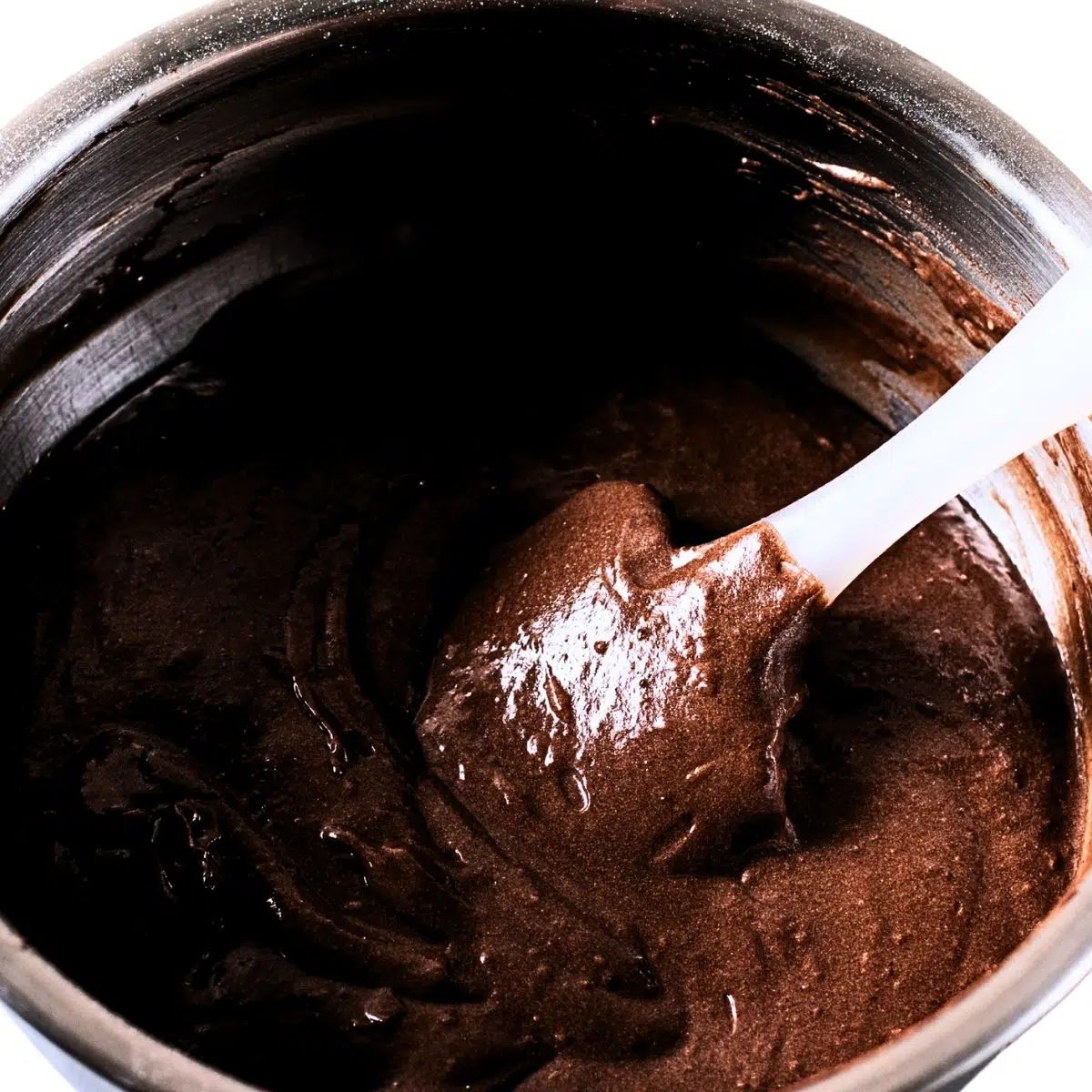 banana brownie batter in silver bowl