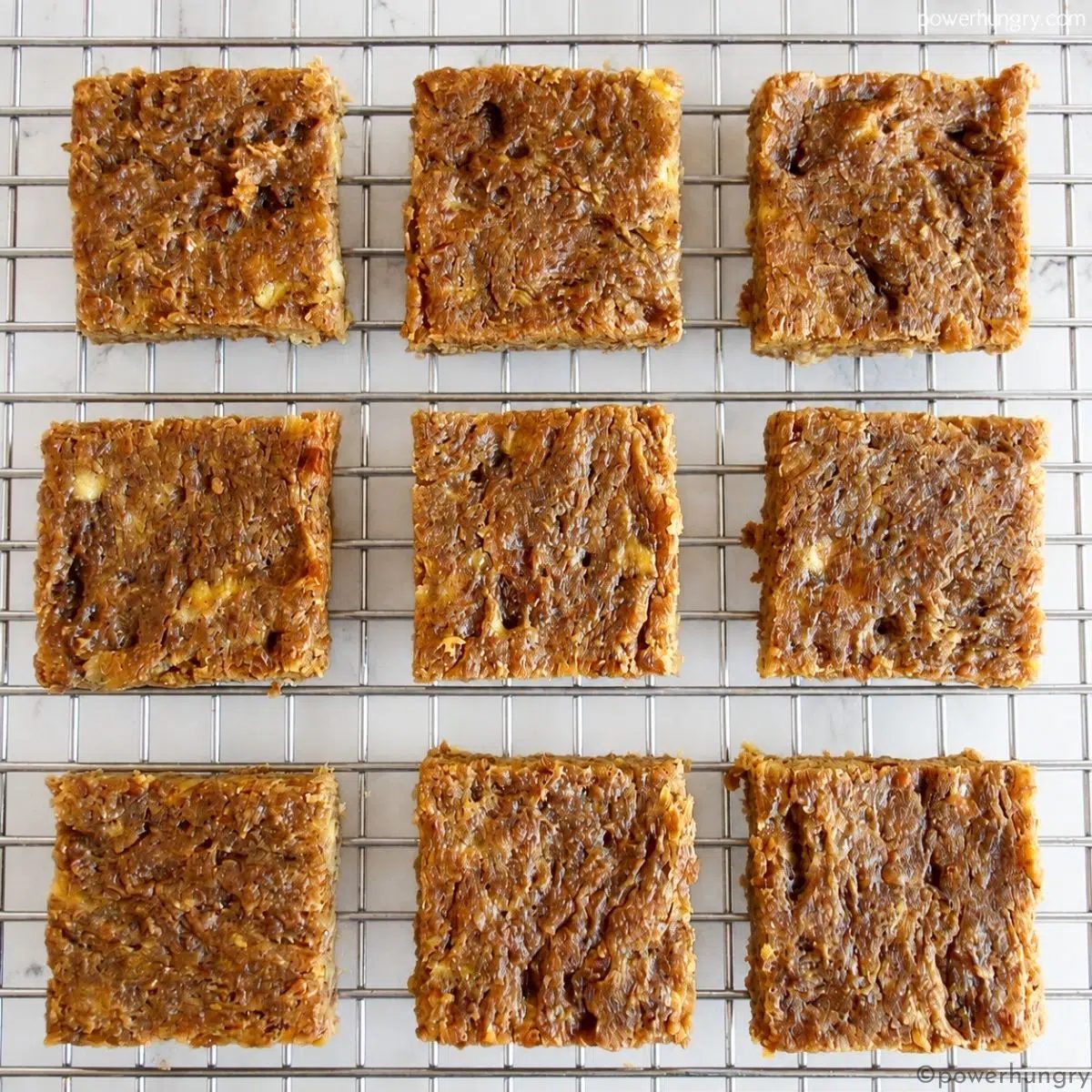 overhead shot of baked banana flax bars on a silver cooling rack
