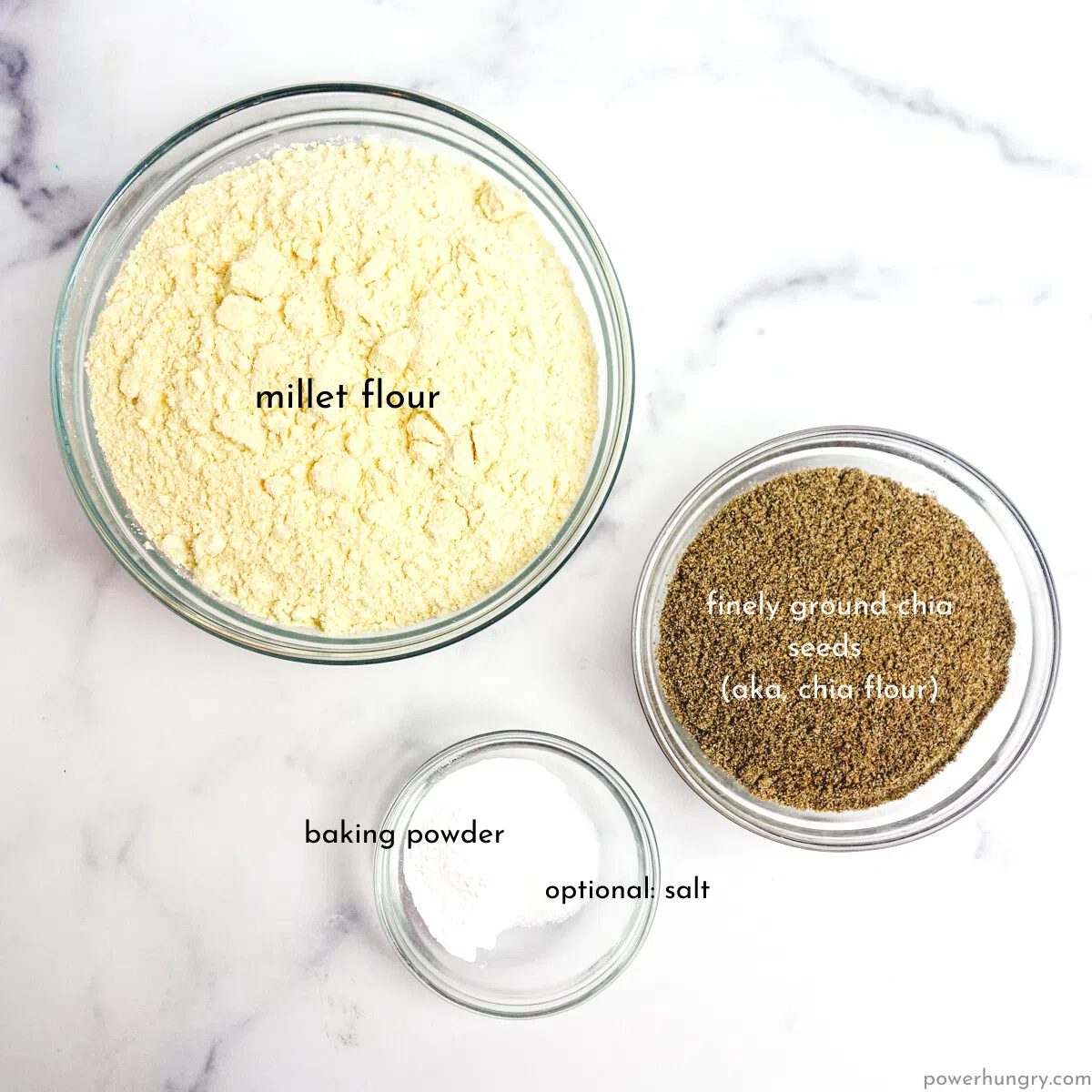 overhead shot of Clea glass bowls filled with the ingredients for chia millet bread