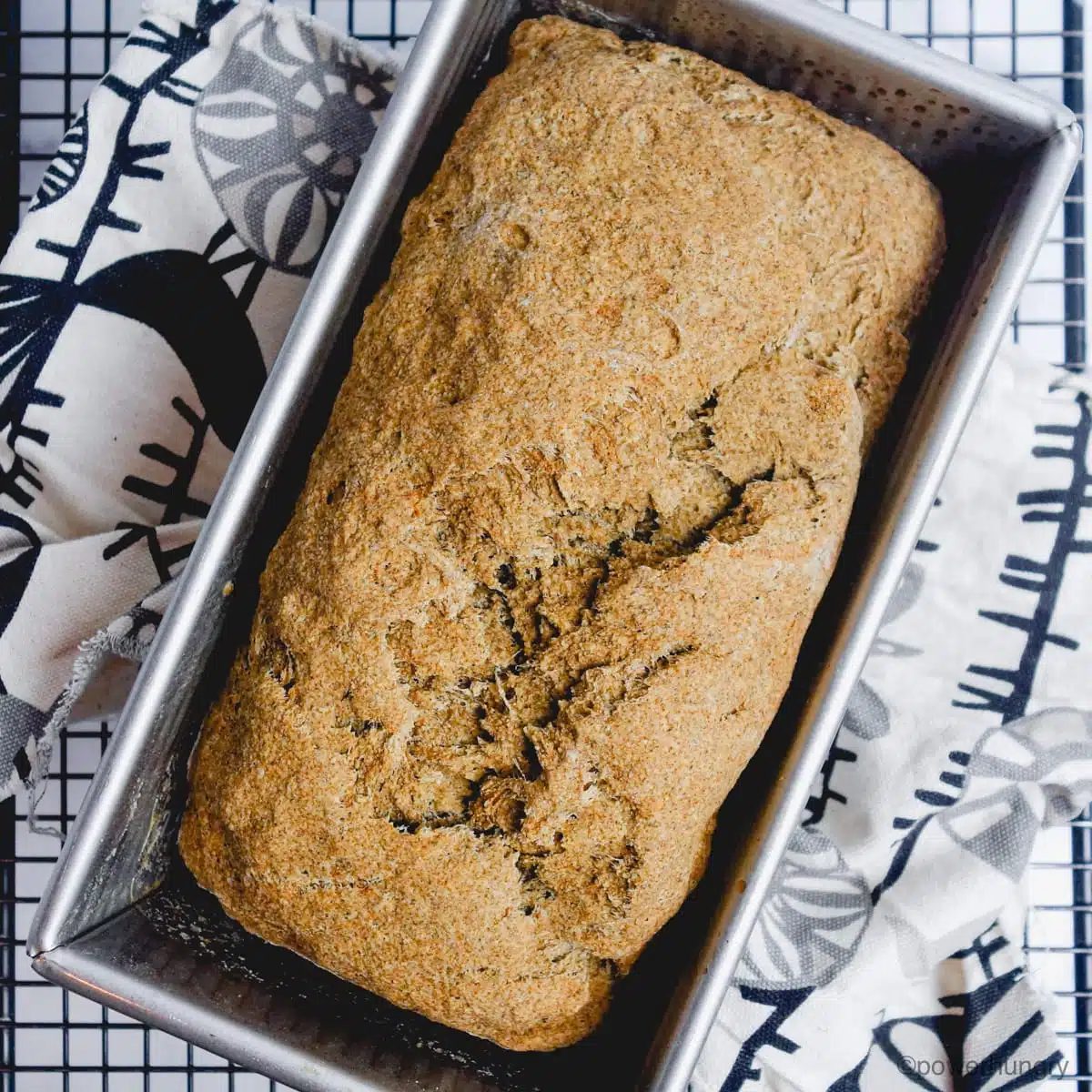 millet chia bread cooling on a black cooling rack