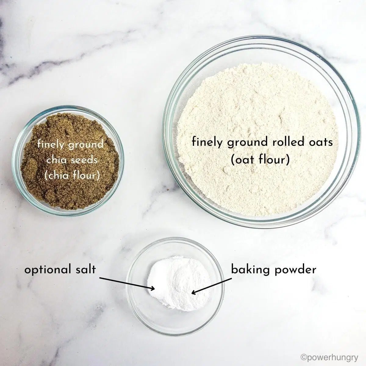 overhead shot of chia oat roll ingredients in clear glass bowls