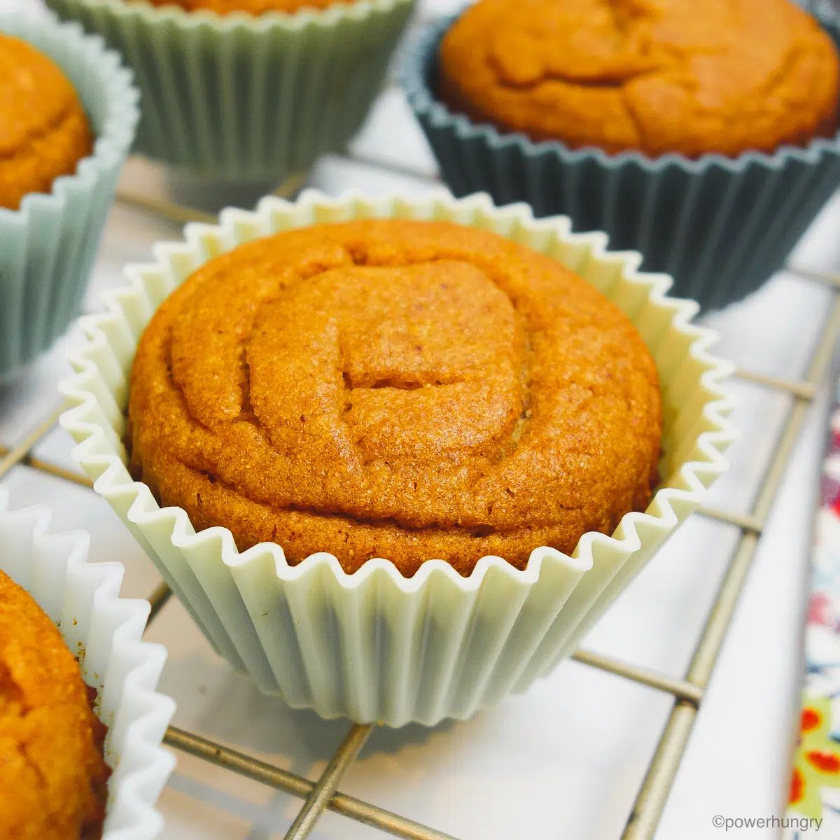chickpea flour date muffins on a cooling rack
