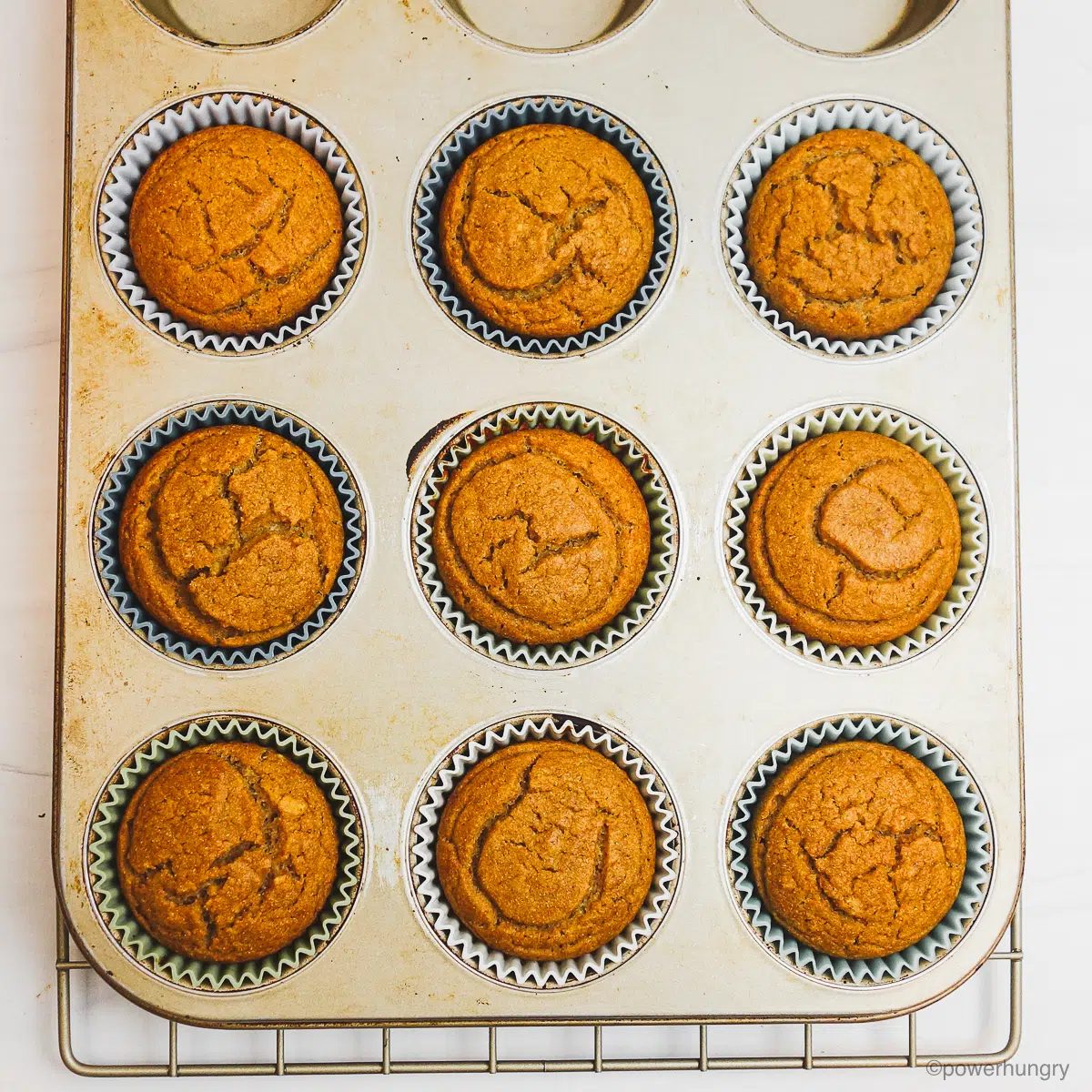 baked chickpea flour date muffins in a muffin tin
