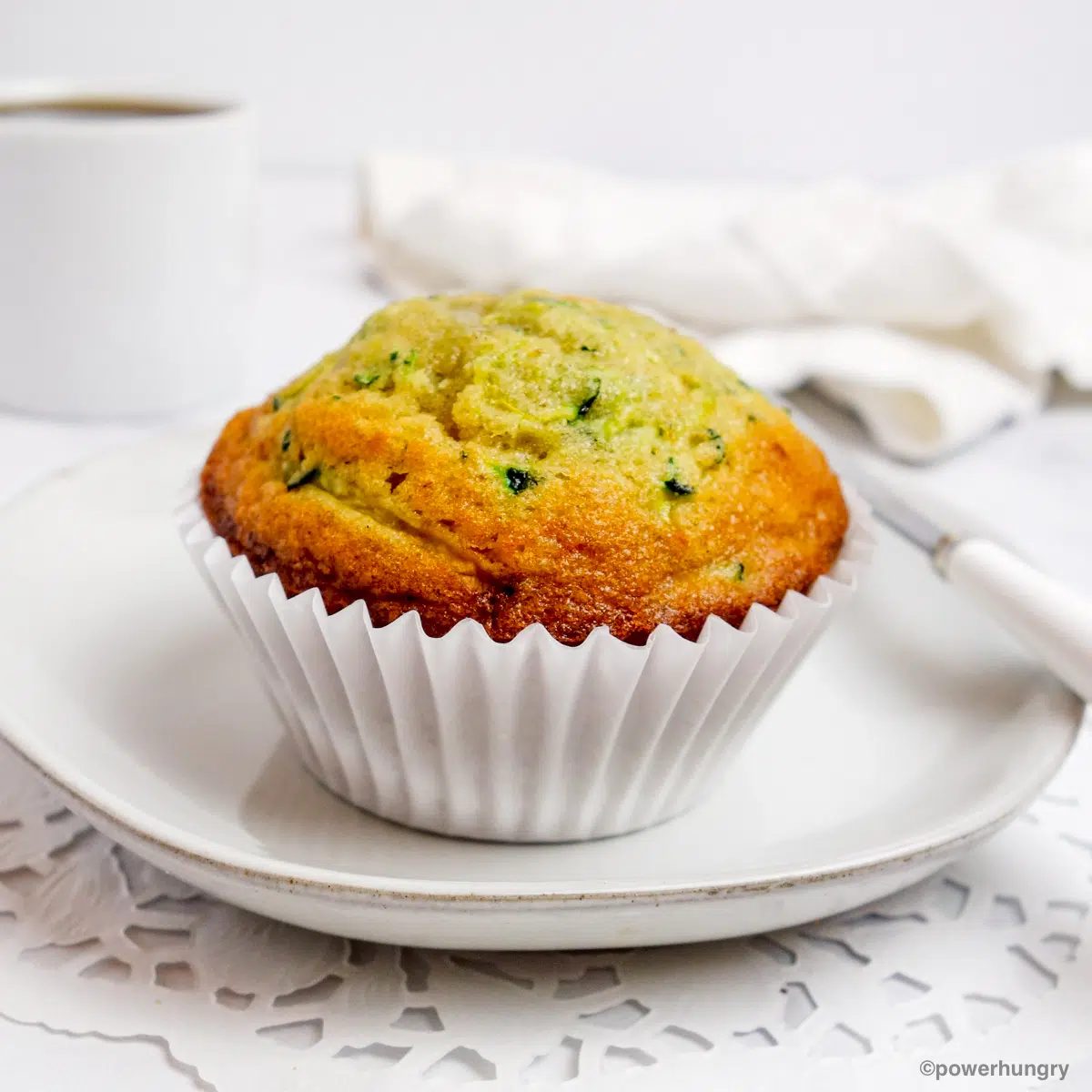 3 ingredient chickpea flour zucchini muffin on a white plate