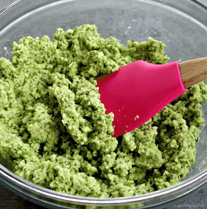 glass bowl filled with dough for broccoli chickpea flour flatbread