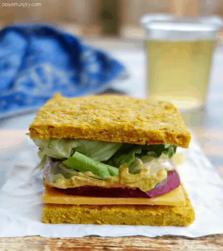 vegan sandwich made with carrot chickpea flour flatbread