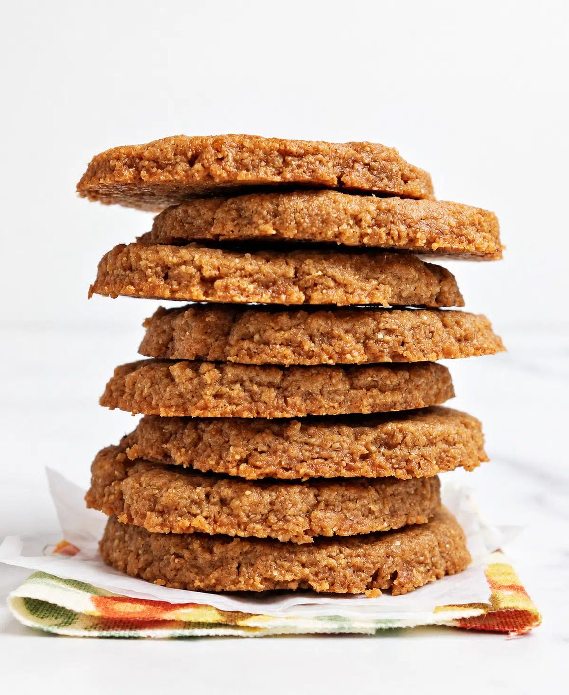 stack of 3-ingredient flaxseed cookies on a floral napkin