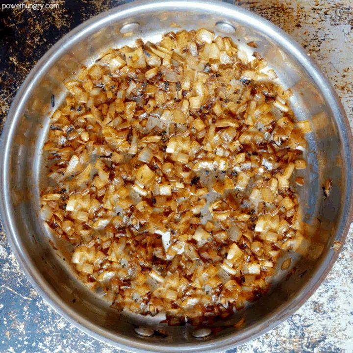 overhead shot of sautéed onions in a skillet