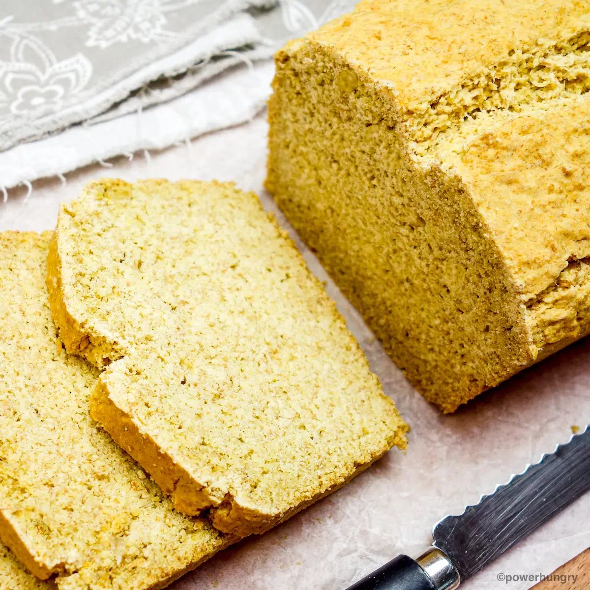 sliced millet flax bread on a cutting board
