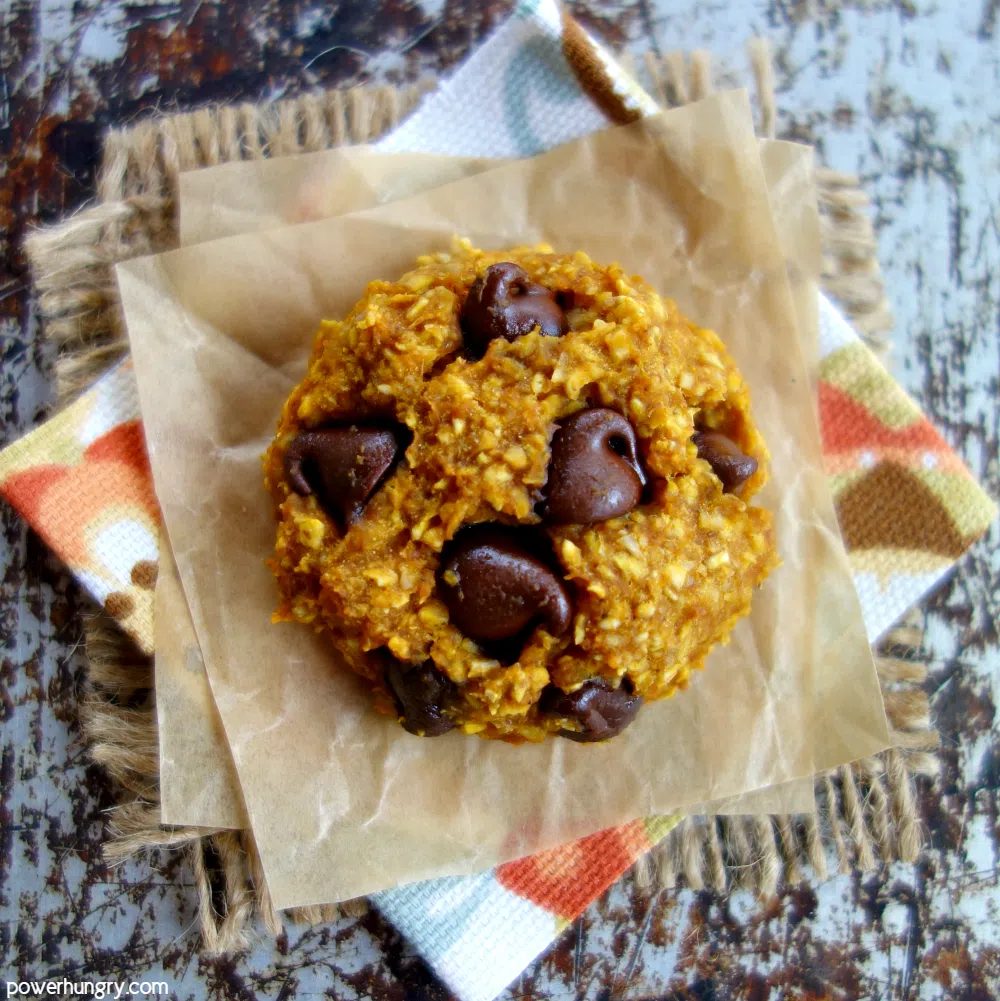 a single pumpkin oat cookie on a floral napkin