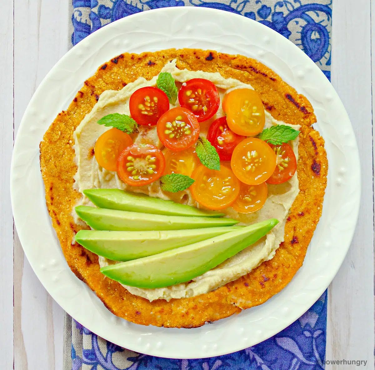 over head shot of sweet potato tortilla with vegetable toppings
