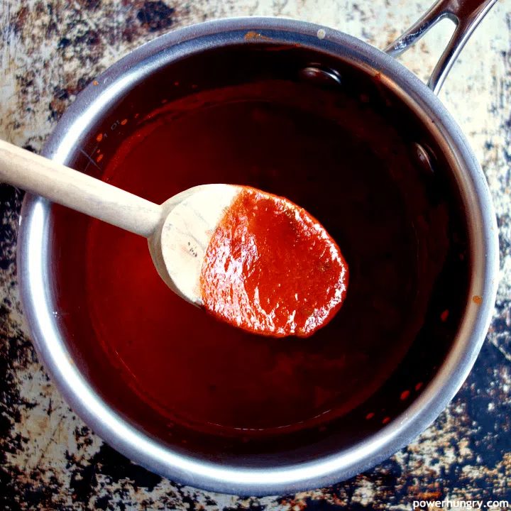 saucepan with simmered crushed tomatoes and enchilada sauce