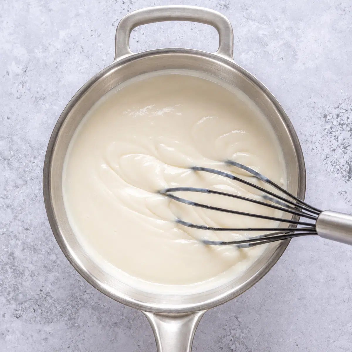 vegan panna cotta thickened in a saucepan