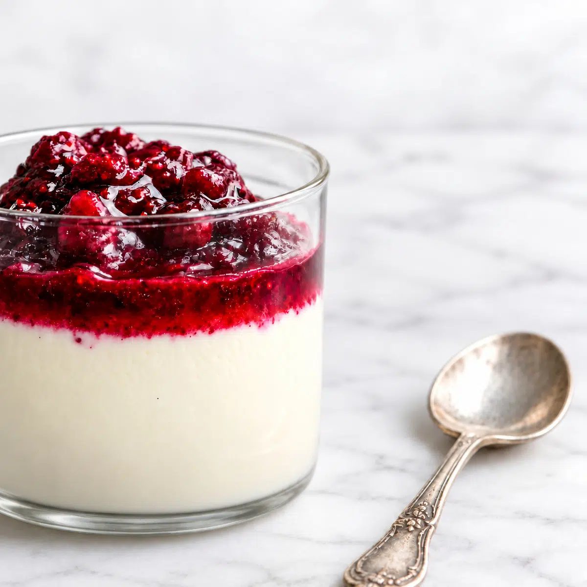vegan panna cotta side view with a spoon