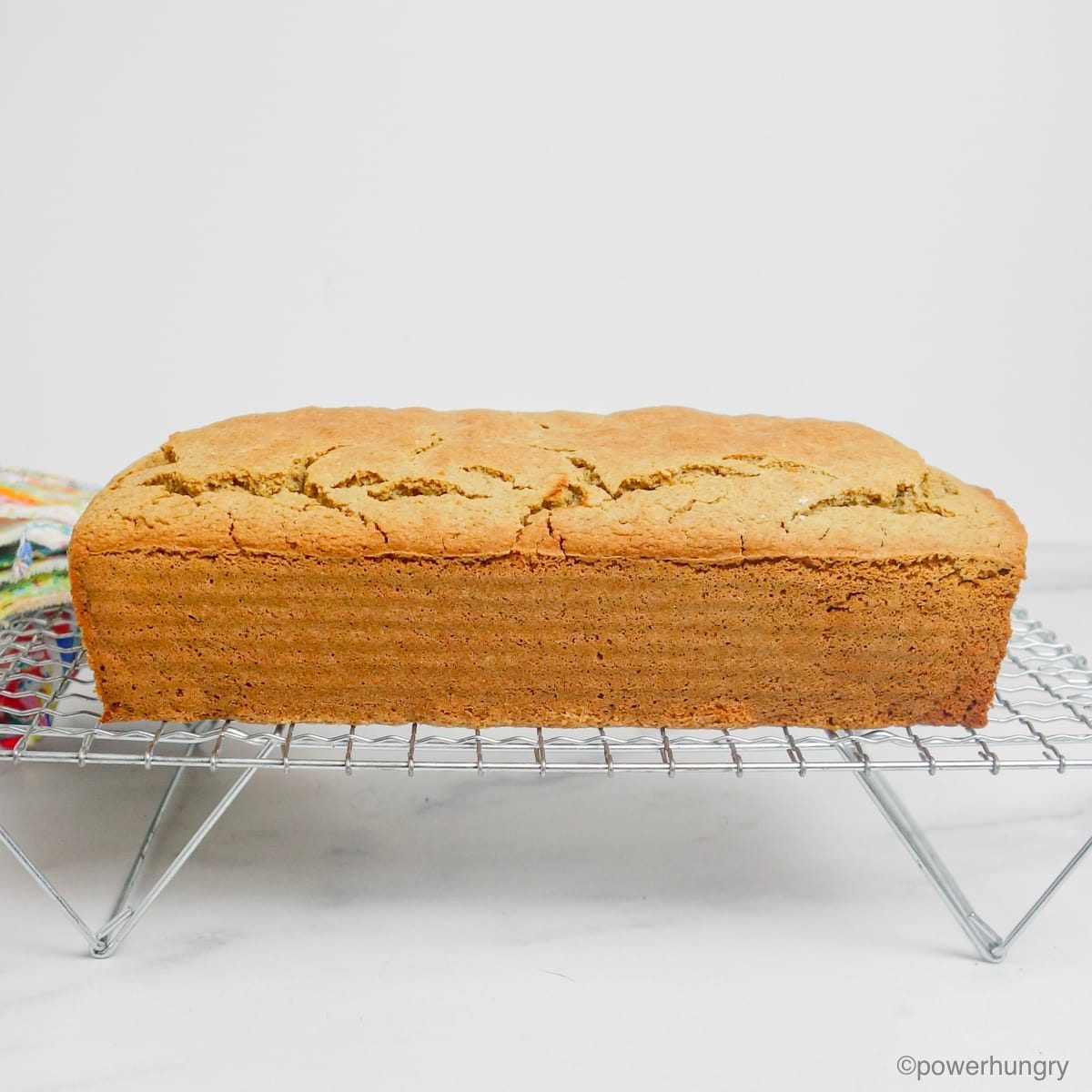 oat flour soda bread, removed from its pan, cooling on a cooling rack