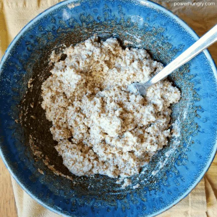 dough for almond and flax biscuits in a blue bowl
