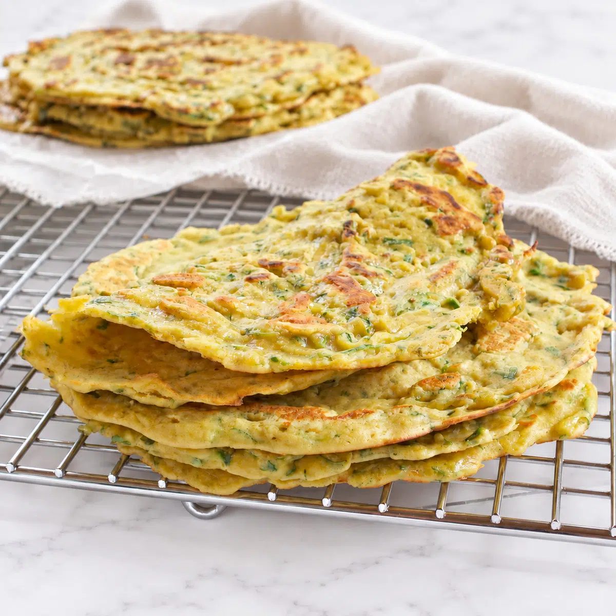 zucchini flatbread recipe made with chickpea flour on cooling rack