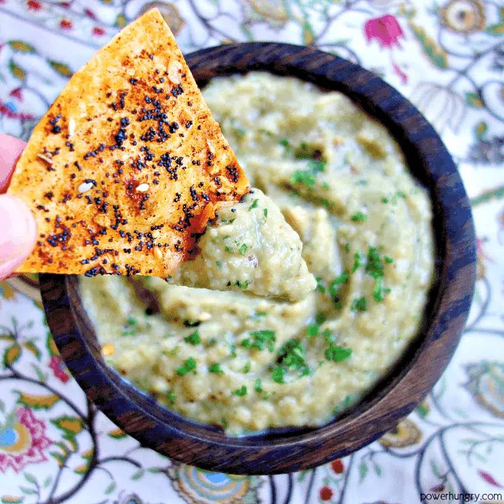 multi-seed chip dunked in vegan keto Thai eggplant dip