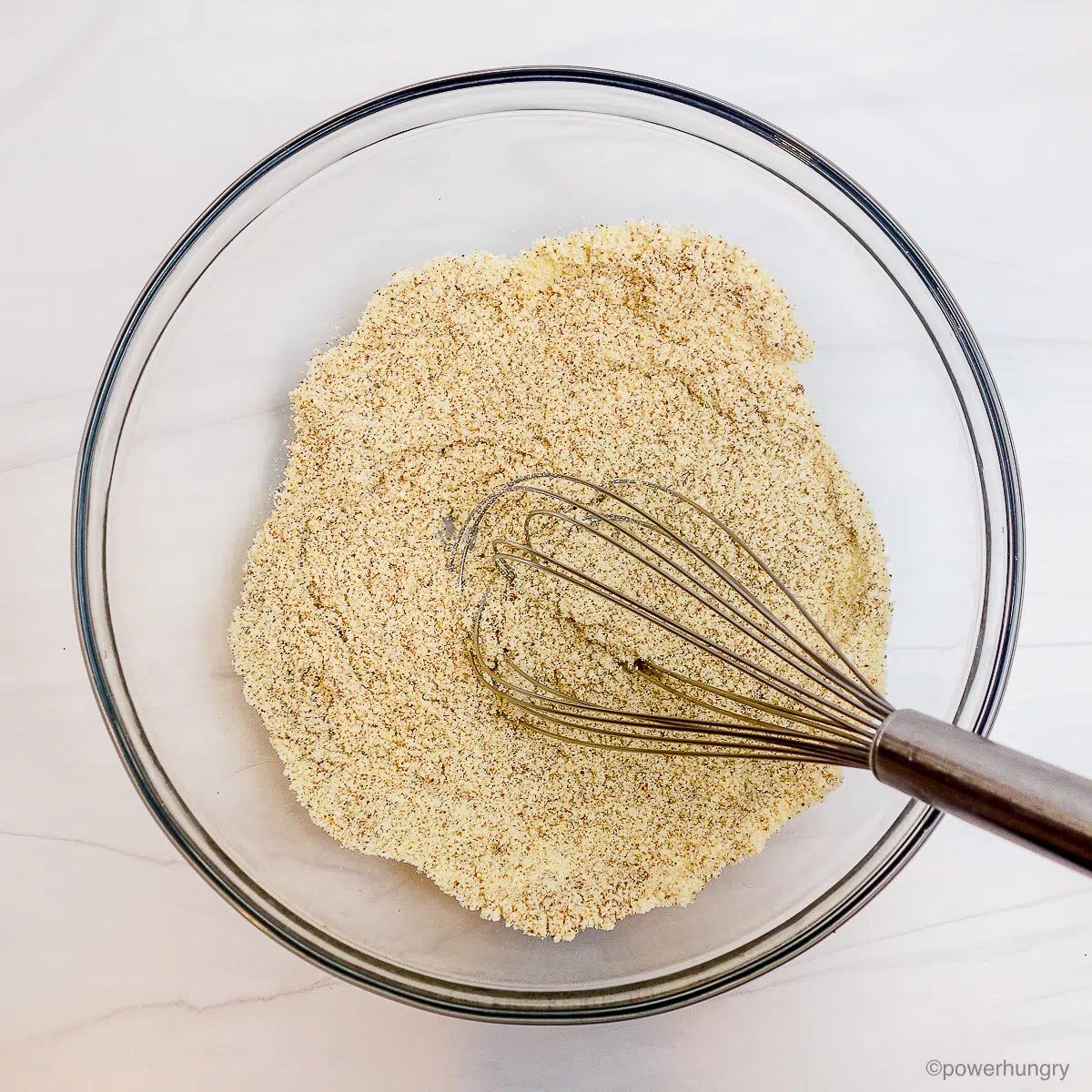 glass bowl filled with dry ingredients for cookies