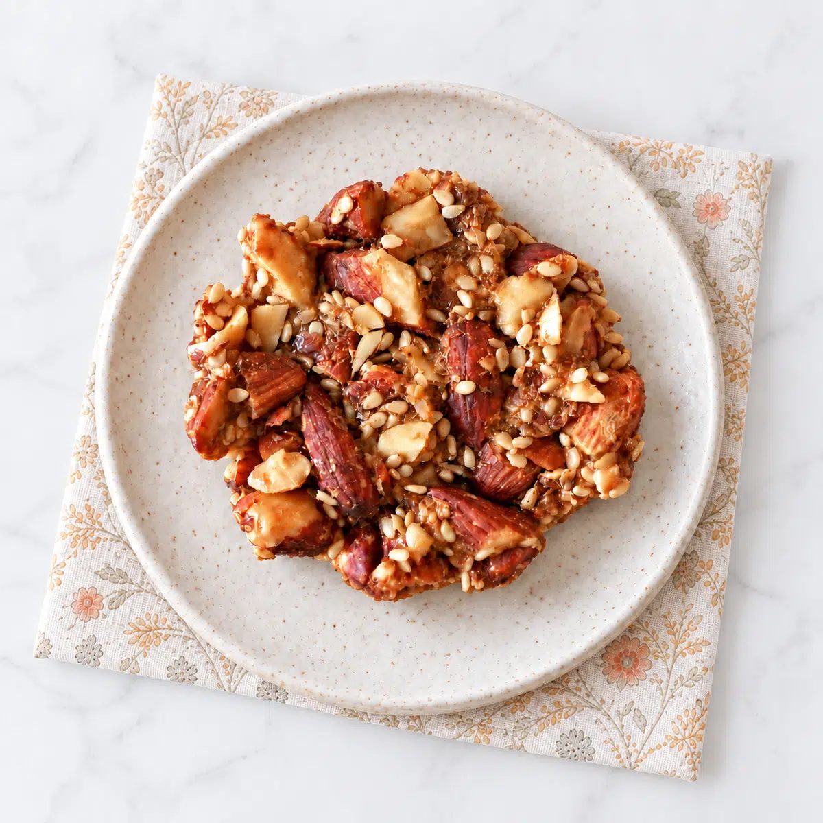 a single almond sesame cluster on a plate